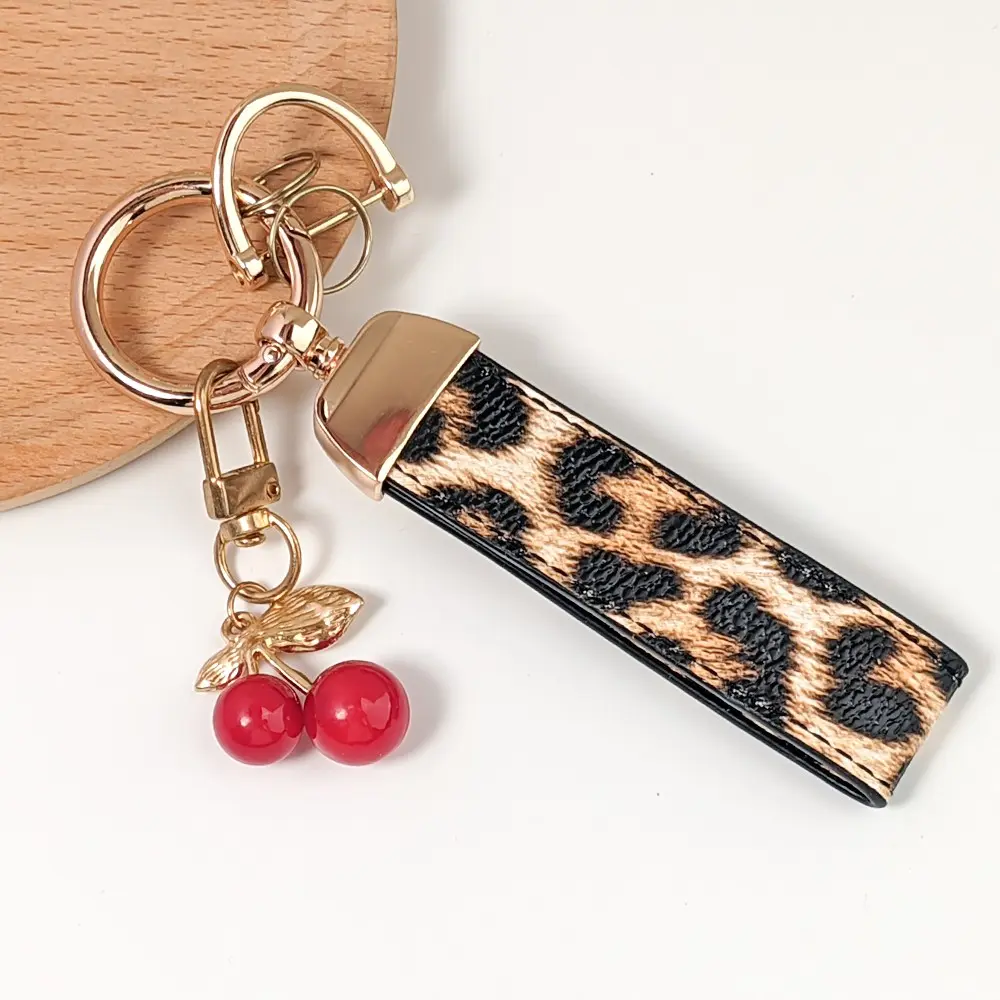 Elegant Leopard Print Leather Keychain with Cute Cherry Pendant, Fashionable and Multifunctional, Perfect Backpack Accessory, Ideal Valentine's Gift, Bag Key Accessory
