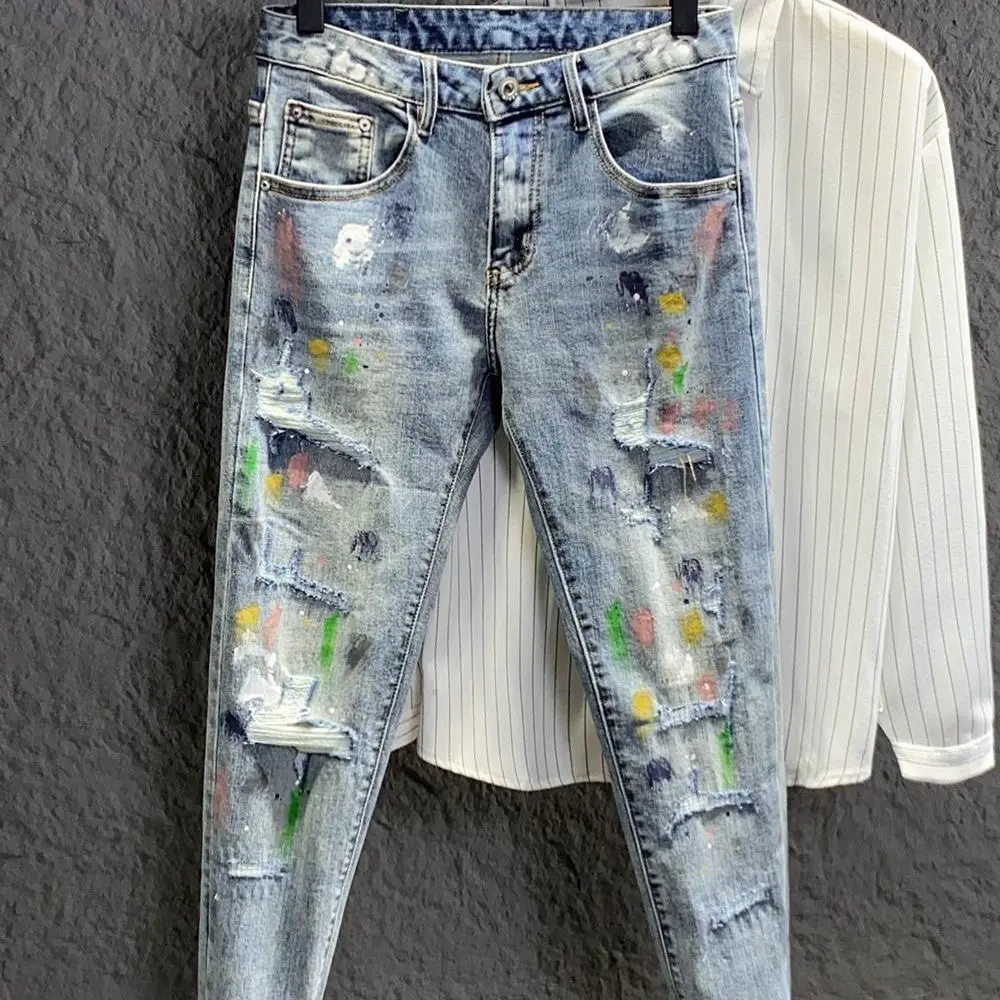 Men's Light Blue Cotton Blend Acid-Washed Distressed Letters Slim-Fit Tapered Cropped Jeans - Menswear Casual Spring Weekend Style with Paint Splatters, Rugged Edge, Acid-Washed Distressed Men's Jeans, Cropped Length, Tapered Cut