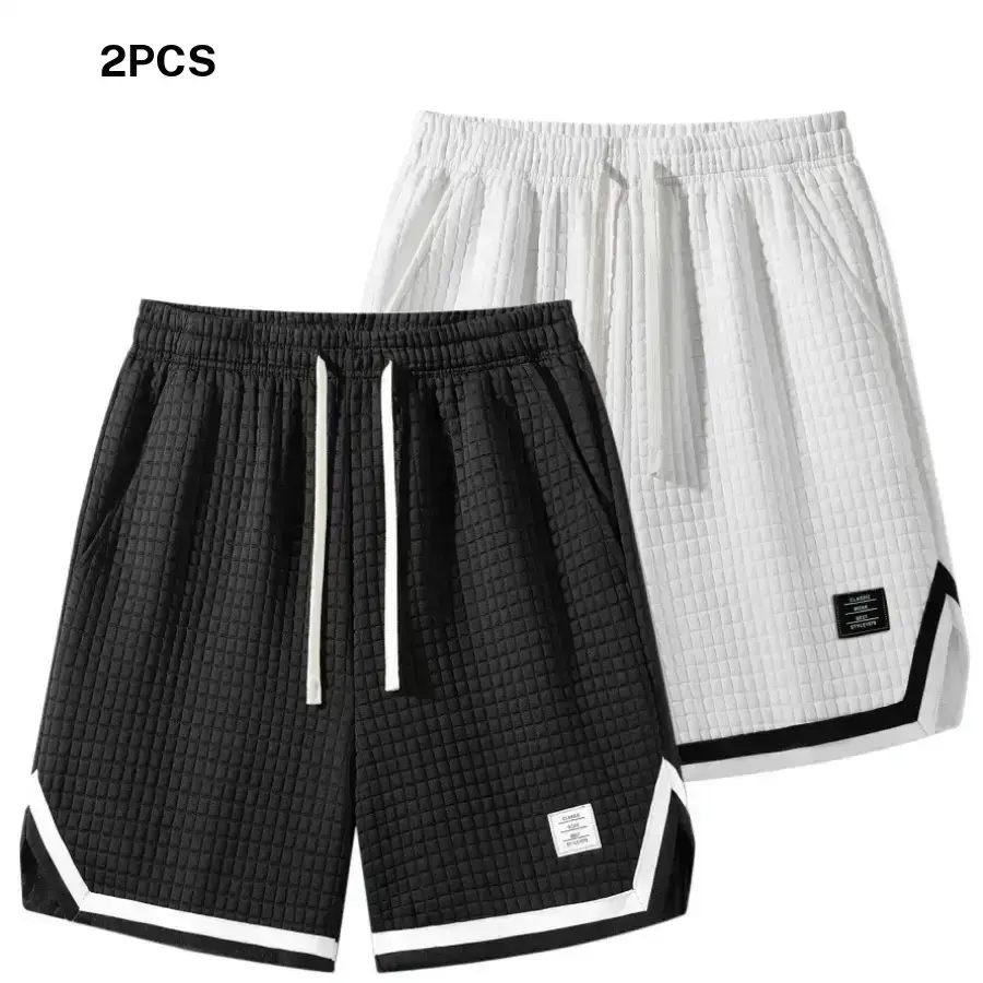 Two men’s casual shorts featuring a waffle texture and drawstring design in contrasting colors. Trendy sporty style with a pure white waffle texture as the main color for a fresh, sophisticated look. Elastic drawstring waistband that fits snugly. Large si