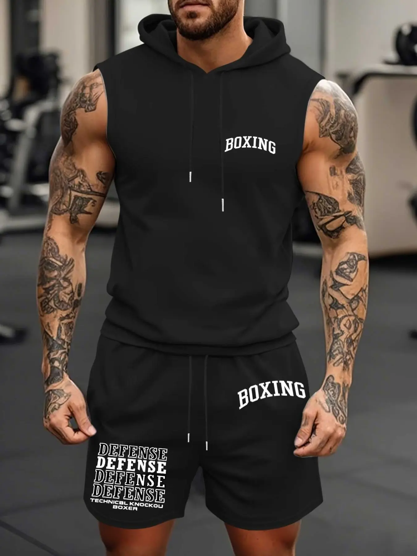 Men's two-piece boxing gym workout set, featuring a silk screen printed hooded vest and drawstring shorts with "boxing" and "defense" patterns, a loose fit for all day comfort. Ideal for boxing training, gym training, and street style