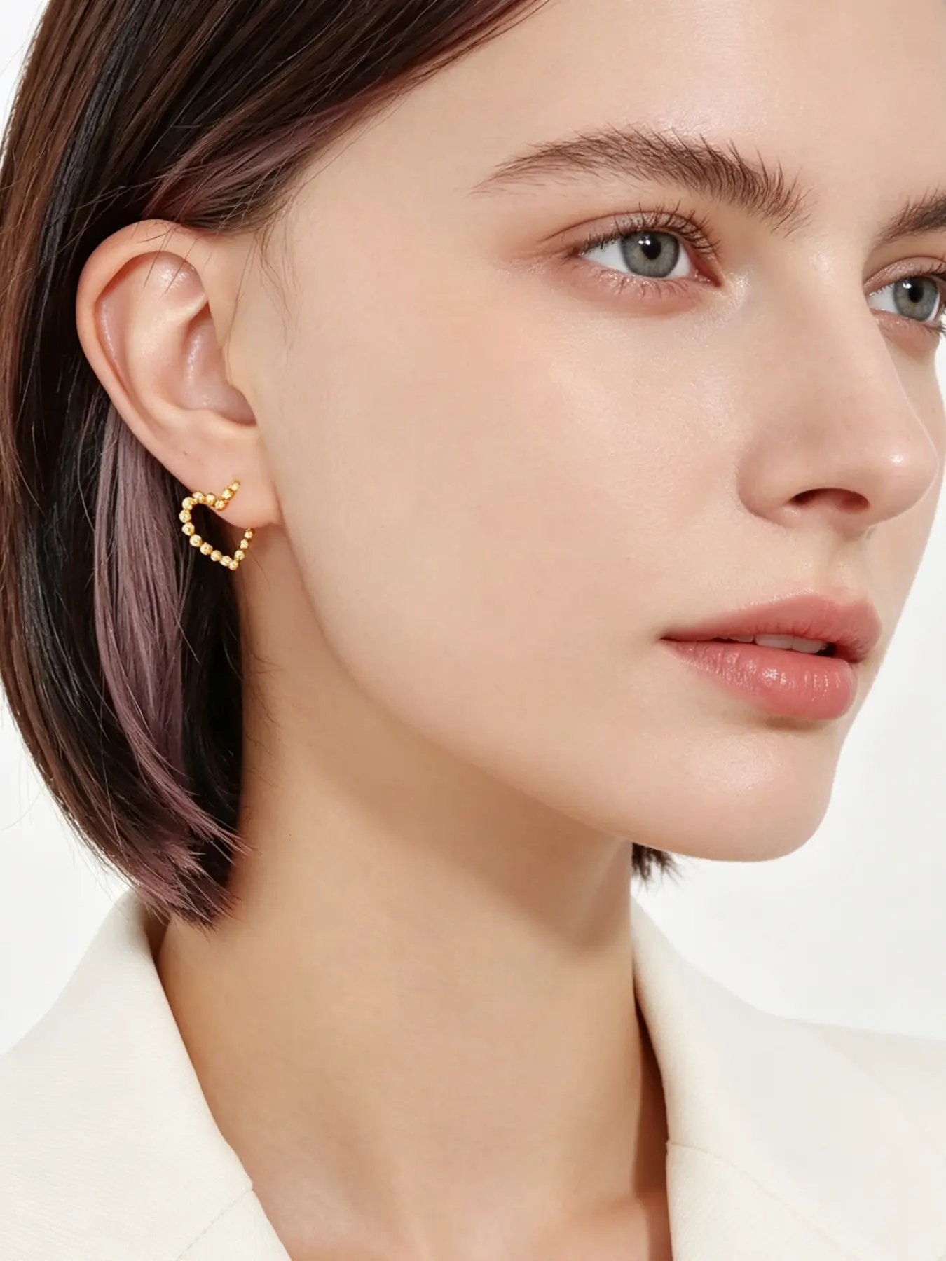 A pair of minimalist heart-shaped lacy earrings with smooth, delicate round beads, exuding a touch of playful charm. Perfect for daily commutes, dates, casual business settings, and more.