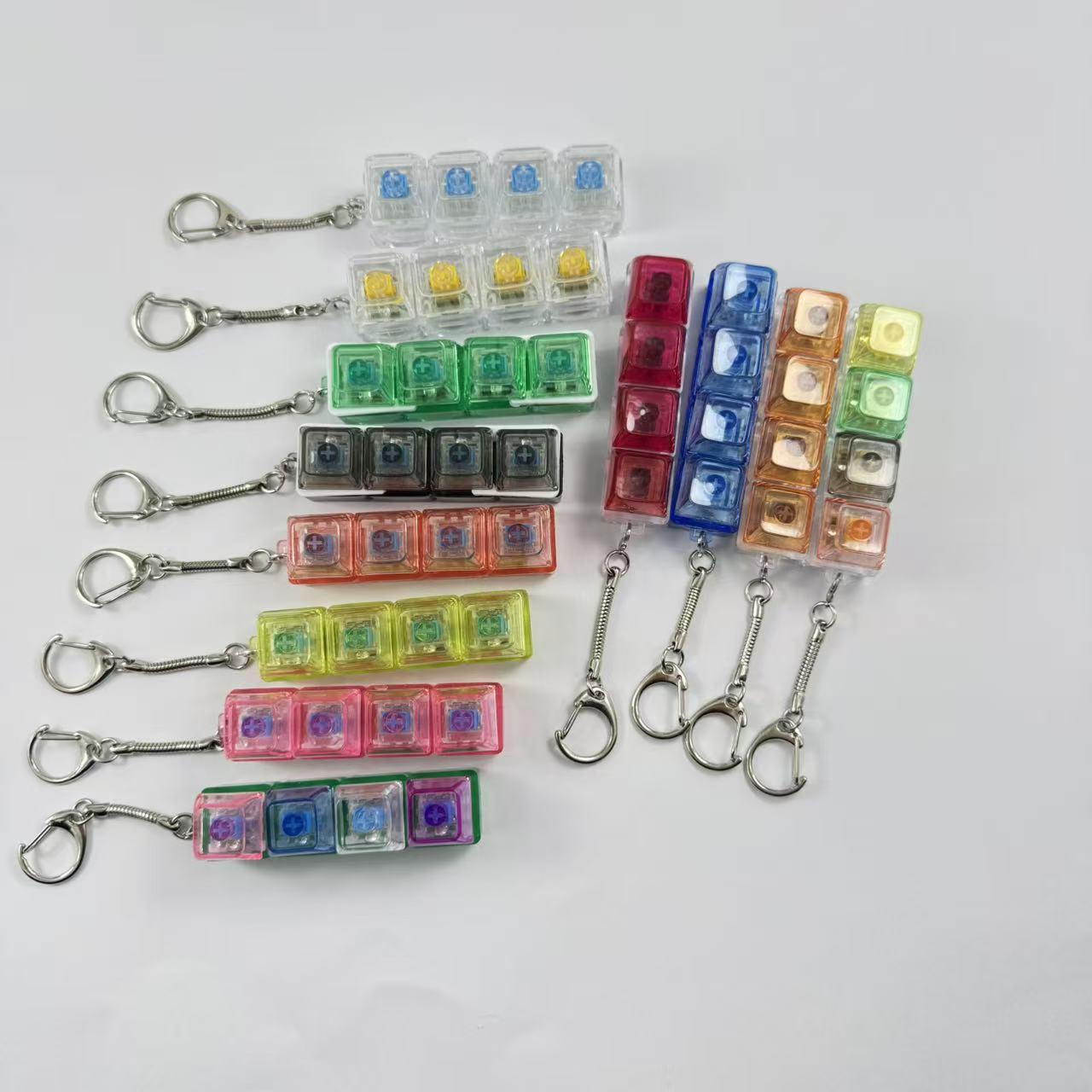 4-key decompression button, Russian Tetris keychain, mechanical key with light-emitting function, stress-reducing fingertip toy key.
