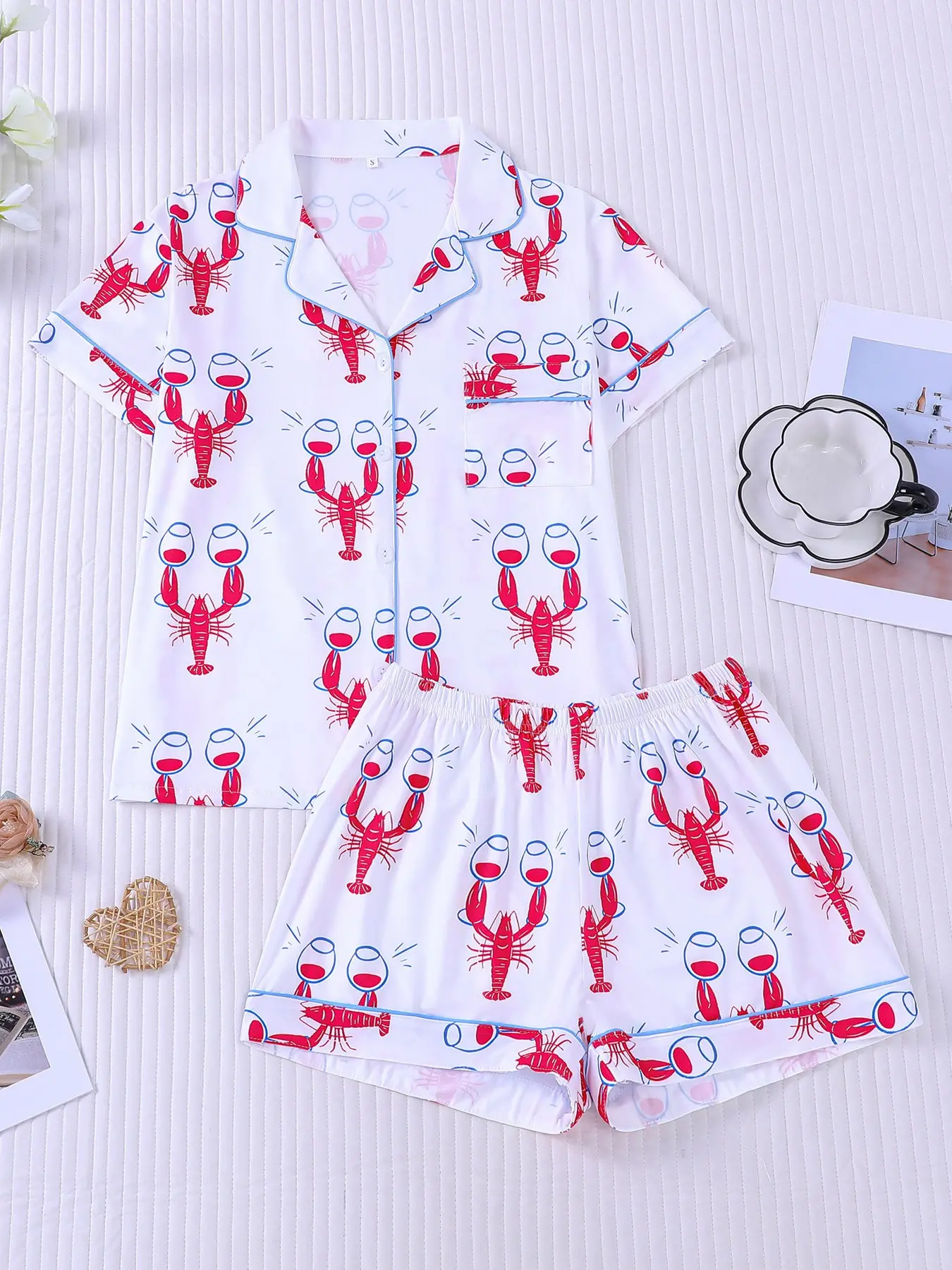 Women's 2-piece pajama set, Pj sets, with fun red lobster & wine glass prints on white base, coastal party style, light blue contrast piping. Lapel top with pocket, soft elastic pajamas shorts, all-season loungewear for women