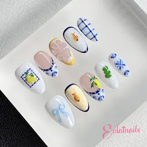 Summer Lime Short Almond Press On Nails, Glossy White Base French Countryside Fake Nails With Vintage Blue Floral, Lemon And Goldfish Prints, Sweet Cottagecore Nails For Tea Parties, Camping Trips And Soft Casual Outfits