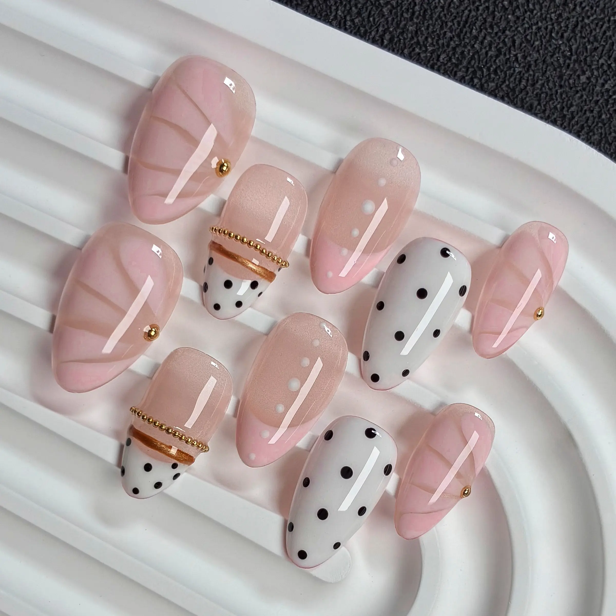 Sweet Pink Dot Press On Nails, Acrylic False Nails, Nail Art, Short Almond, 10pcs Handmade glossy nails with soft designs including sheer nude marble texture, sweet pink gradient tip, black polka dots, elegant reusable fake nails for daily wear