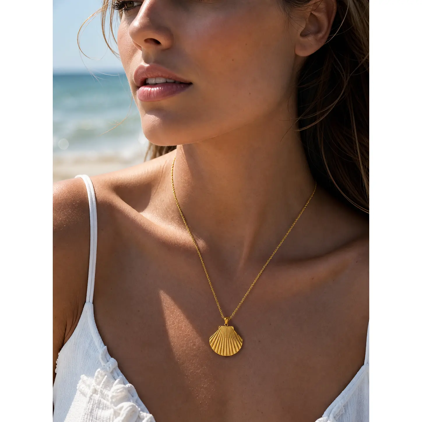 Women's Gold-Plated Shell Pendant Necklace-a simple collarbone-length chain perfect for layering at the beach this summer. Eye-catching jewelry for dates, vacations, and everyday wear-a great gift for your best friends and other close friends