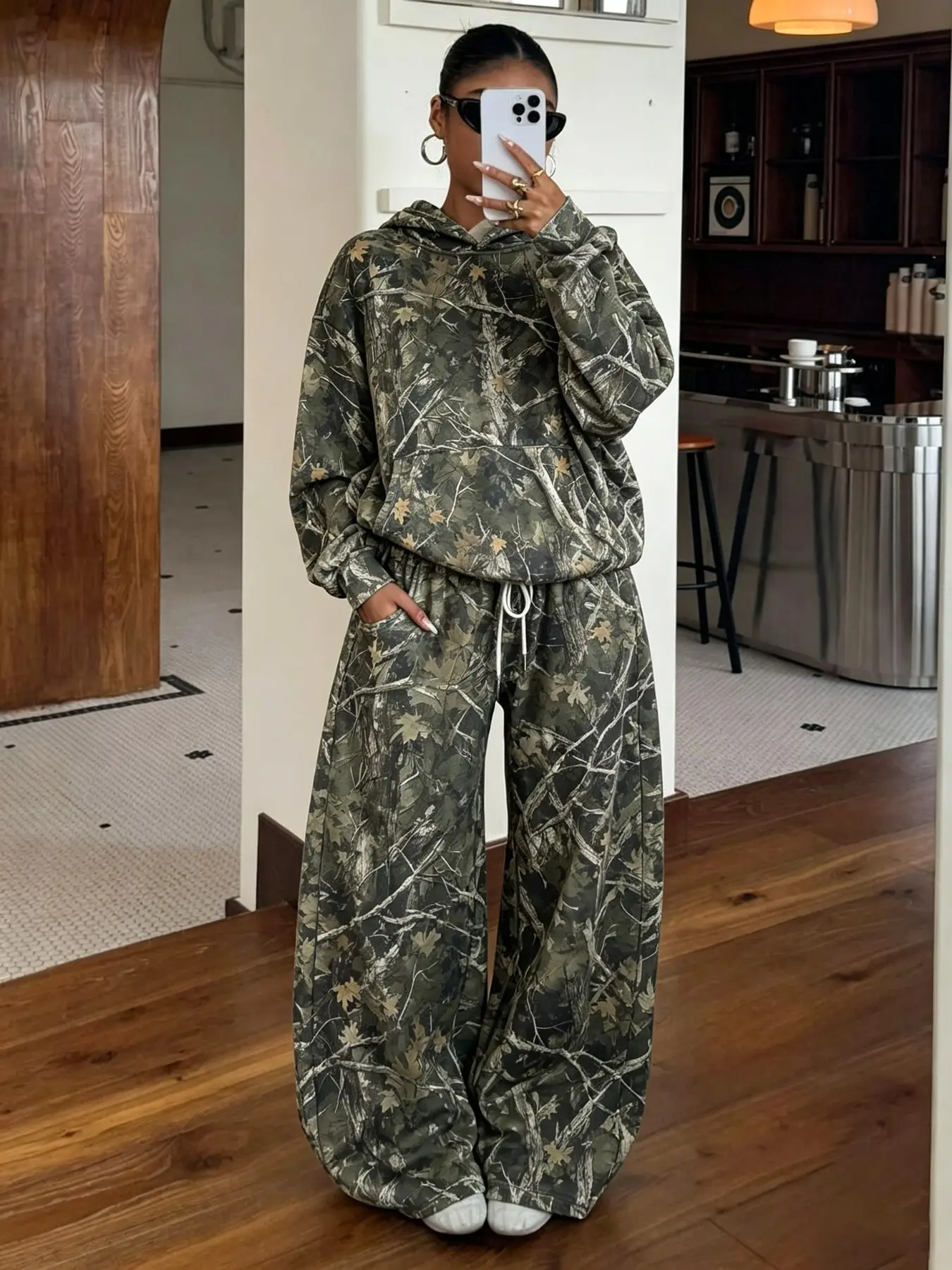 Women’s camo hoodie & wide-leg pants set — leafy tree branch print, oversized fit, drawstring waist, cozy & stylish for lounge, streetwear or casual outings. Soft stretch fabric. One-piece trendy look