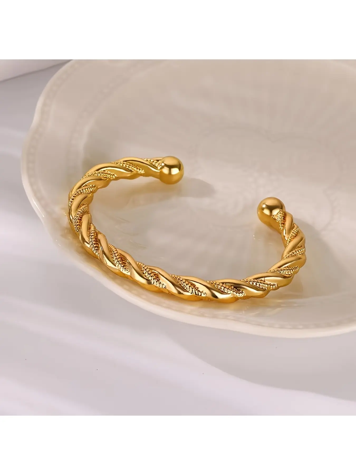 A stainless steel twisted braid design titanium steel bracelet with a C-shaped open clasp, unisex and stylish