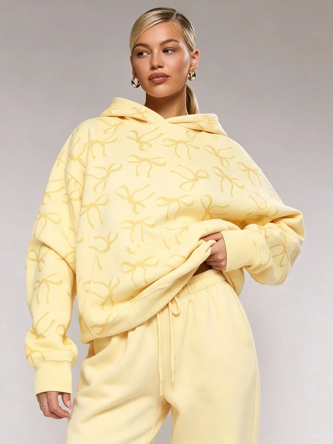 Autumn yellow bow print loose hoodie, Hooded Top, casual and comfortable loungewear, perfect for running errands, coffee dates, pajama styling, and street style. Trendy girly sweatshirt, #bowprinthoodie #yellowhoodie