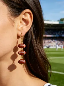 A pair of long and flowing rugby sports earrings, creative and fun simulation mini rugby women's earrings, fashionable European and American trend creative girl earrings, suitable for rugby friends to give to friends, family and sisters.