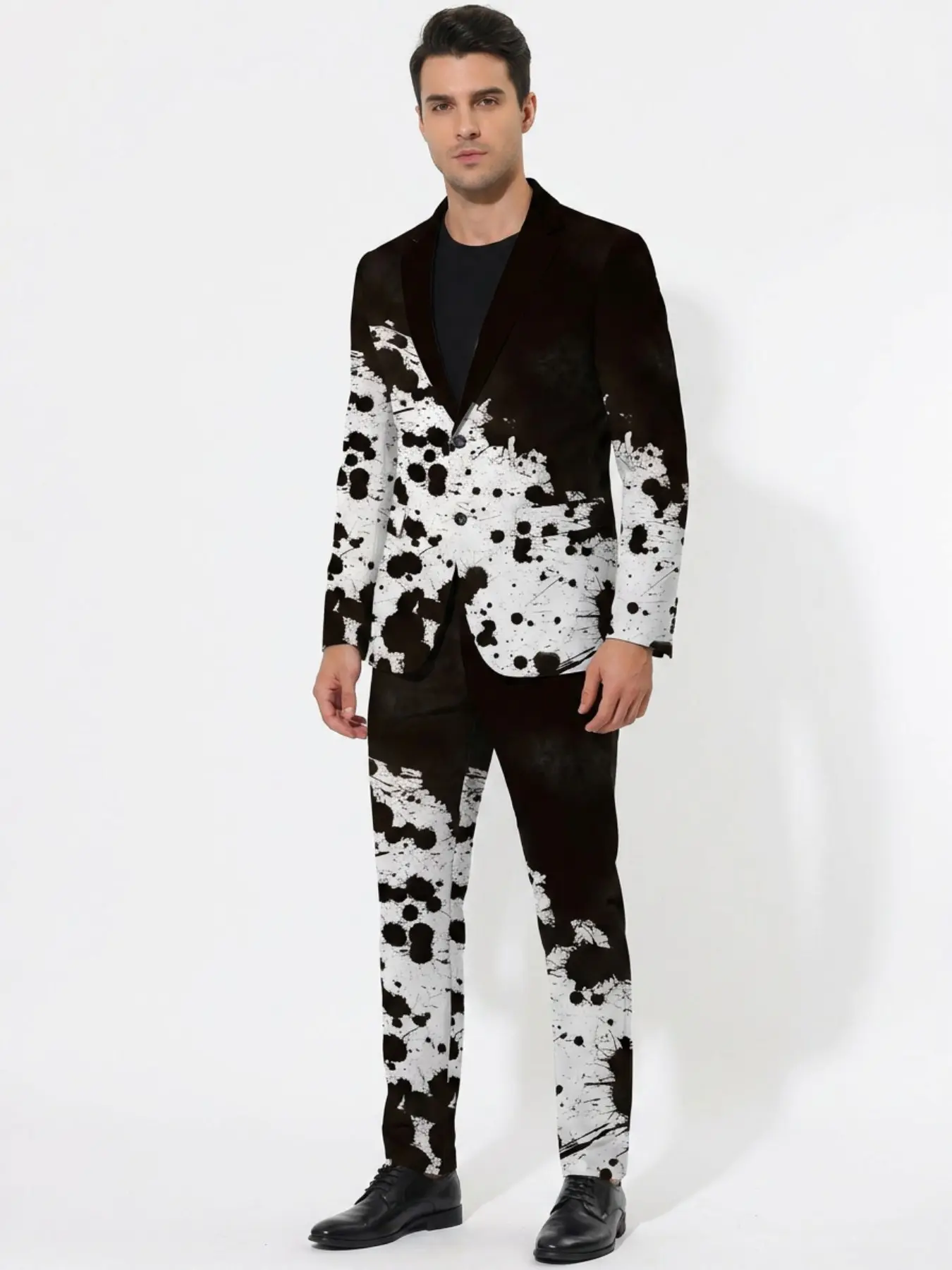 Men's trendy and cool ink splatter print two-piece suit set, featuring a black and white gradient ink splatter art pattern, a slim-fit suit jacket paired with matching trousers, a unique formal suit for the stage and runway.