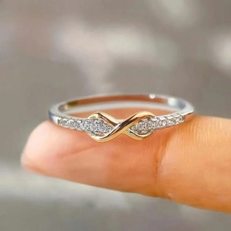 A "Lucky Number 8" ring for women, featuring a delicate, slender band set with sparkling cubic zirconia; its minimalist, polished design offers elegant simplicity suitable for casual everyday wear, or it can even serve as a bag charm.