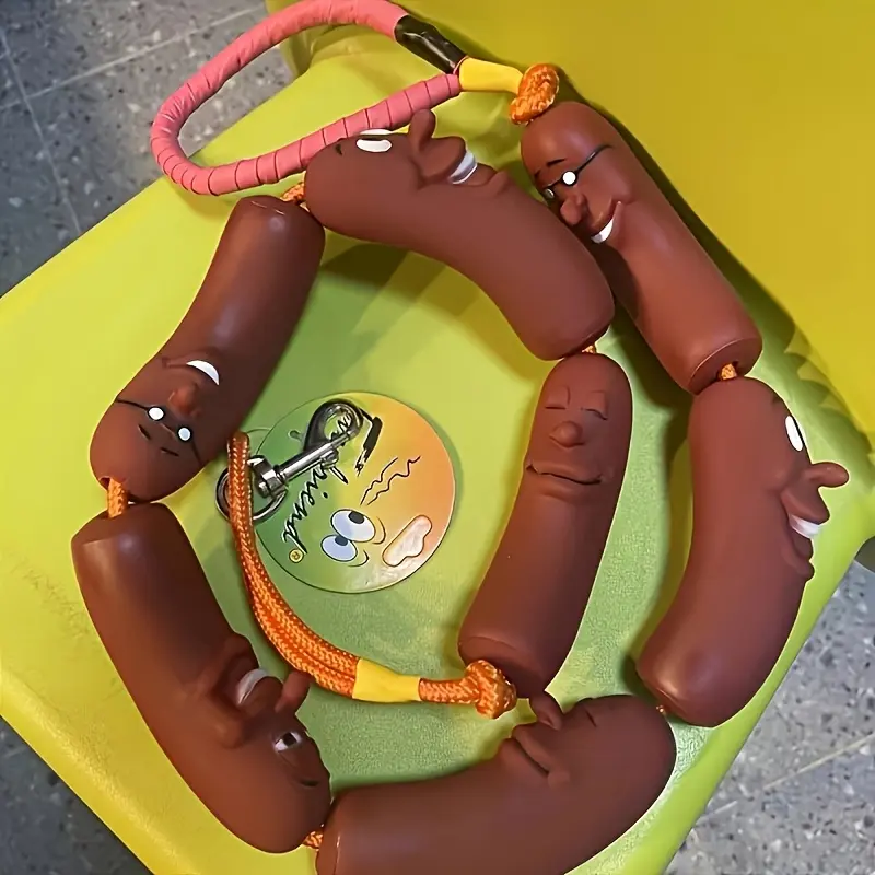A fun sausage shaped dog leash suitable for small and medium-sized dogs, with a durable rubber handheld traction strap designed in a cartoon style - a unique and interesting shape, a must-have for pet owners.